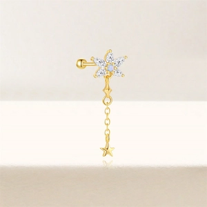 Detail of gold floral cartilage stud with blue opal, zircons and star chain