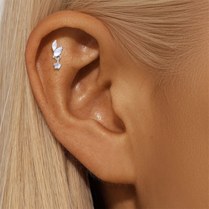 Close-up of S925 silver helix stud with moonstone leaves and a tiny star pendant