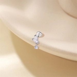 Macro view of S925 sterling silver leaf moonstone labret stud with a star dangle