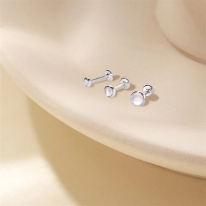 Detailed view of S925 sterling silver studs with round natural blue fire moonstone