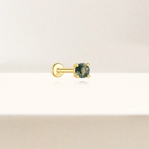 Detail of S925 silver gold-plated labret stud with a natural green moss agate stone