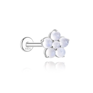Macro detail of S925 sterling silver flower piercing stud with natural moonstones