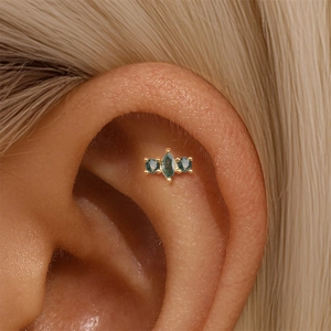 Close-up of s925 gold moss agate stud earring featuring marquise cut stones on a model