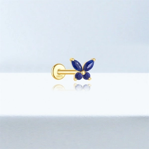 Detailed macro shot of S925 silver butterfly stud earring with blue lapis lazuli stones