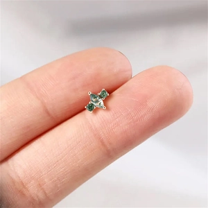 Close-up of s925 silver stud earring featuring marquise cut green moss agate stones