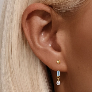 Close-up of S925 sterling silver stud and earring set with blue gemstone and zircon