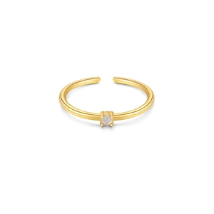Close-up of adjustable gold ring featuring an oval opal stone with four-prong setting