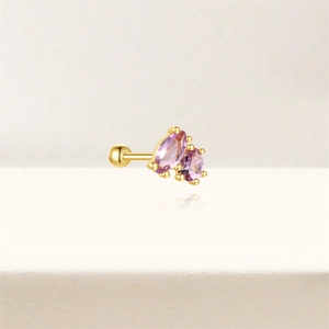 Detail of gold s925 silver ear stud with purple marquise and oval cut gemstones