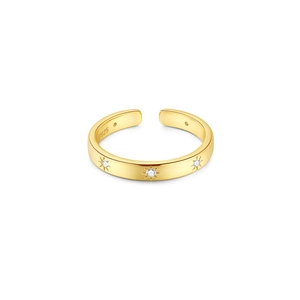 Detailed macro view of S925 sterling silver gold ring with engraved star pattern