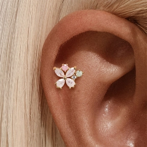 Close-up of s925 silver sunflower cartilage earring with pink and green zircon stones