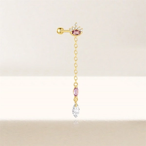 Close-up of golden crown earring with purple gemstones and marquise cut crystal chain