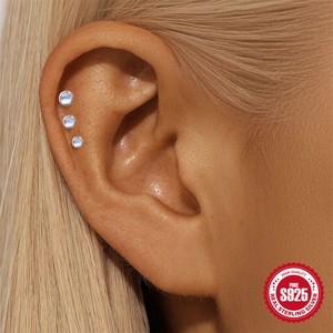 Three pieces of s925 sterling silver moonstone stud earrings worn on the ear helix