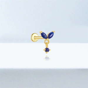 Detailed close-up of S925 silver gold-plated labret earring with blue lapis lazuli stones