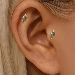 Close-up of geometric S925 gold stud earring featuring green moss agate and white zircon