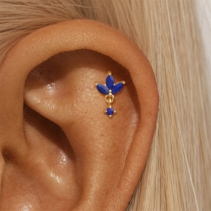 Close-up of a s925 gold-plated ear cuff with blue marquise-cut lapis lazuli stones