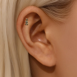 Detail shot of gold s925 ear studs featuring three vertical teal moss agate stones