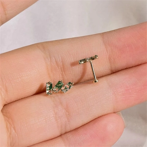 Detail of s925 gold earrings with three rectangular green moss agates in a tiered design
