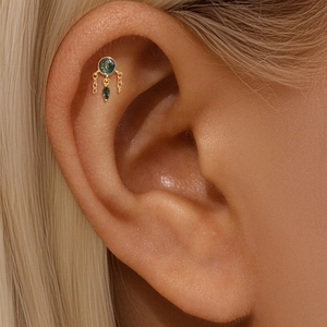Detailed view of s925 gold ear stud with green moss agate and delicate hanging chains