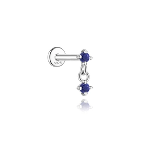 Macro shot of S925 sterling silver ear stud featuring blue round lapis lazuli stones