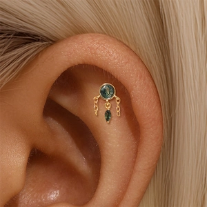 Detailed close-up of S925 gold earring featuring natural green moss agate and chain drops