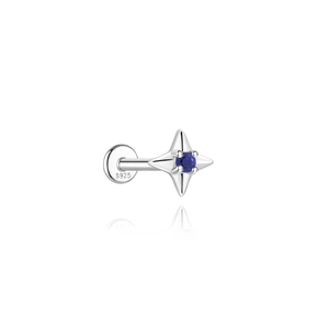 Macro shot of S925 silver four-pointed star stud featuring a round blue lapis stone