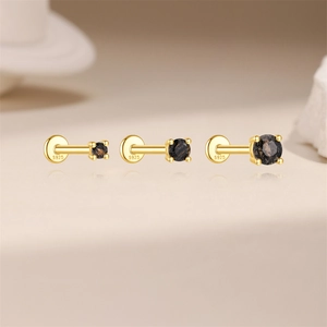 Detailed macro of S925 sterling silver stamp on golden black rutilated quartz studs