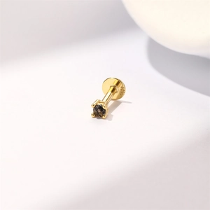 Macro detail of S925 sterling silver earring base featuring clear hallmark and gold plating