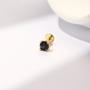 Detailed view of S925 sterling silver gold labret earring with black gemstone inlay