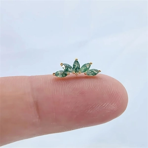 Detailed close-up of s925 moss agate earrings with green gemstones in gold prong setting
