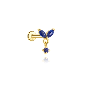Macro detail of S925 silver gold-plated labret stud with blue lapis lazuli stones