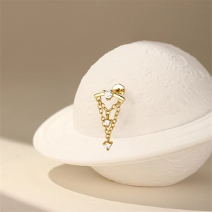 Close-up of S925 sterling silver stamp on golden tassel earring with cubic zirconia