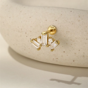 Macro shot of S925 sterling silver ear stud featuring crown-shaped zircon fan design