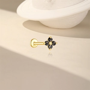 Detail of S925 sterling silver flower labret with black rutilated quartz gemstones