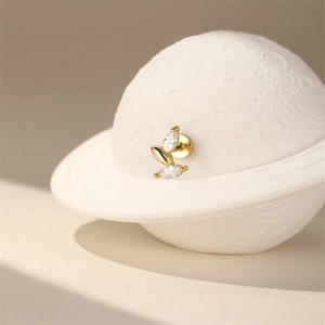 Detail of s925 silver labret earring with marquise zircon leaves and gold finish