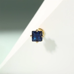 Macro shot of square blue zircon stud earring with flat back in gold-plated 925 silver