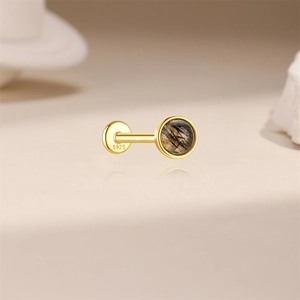 Close-up of golden S925 sterling silver ear stud with round black rutilated quartz gemstone
