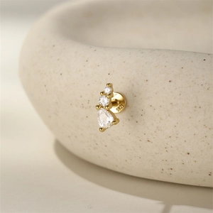 Macro shot of S925 sterling silver ear stud with zircons and visible hallmark