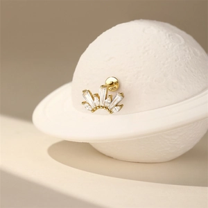 Detail shot of golden crown earring with marquise zircon and S925 silver hallmark
