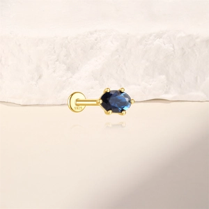 Macro shot of S925 sterling silver flat back stud with an oval blue zircon setting