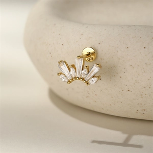 Detailed macro view of S925 sterling silver crown earring with cubic zirconia inlay