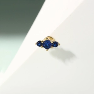 Macro shot of three blue zircons in gold-plated S925 sterling silver ear studs