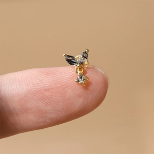 Detailed macro view of S925 silver gold crown stud earring with black rutilated quartz