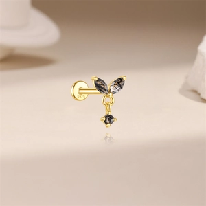 Macro view of S925 sterling silver stamp on golden geometric rutilated quartz stud