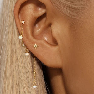 Detail of s925 silver gold-plated star stud and long tassel chain earring set with opal beads