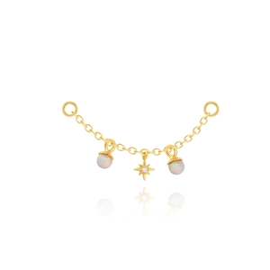 Close-up of gold chain earring accessory with opal beads and an eight-pointed star charm