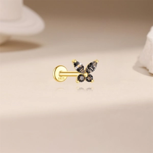 Macro view of S925 silver butterfly labret earring with black rutilated quartz gems