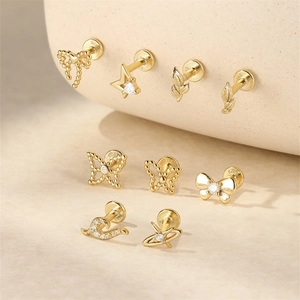 Detail of s925 silver gold studs featuring bow and leaf shapes with zircon stones