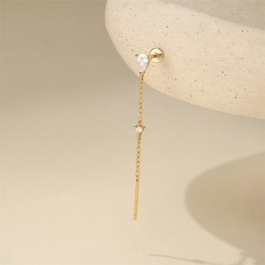 Detail showing the S925 hallmark on a gold-plated long tassel earring with zircons