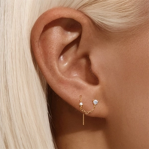Detail of s925 silver gold-plated flower heart chain earrings with zircon studs