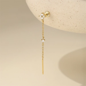 Macro detail of S925 sterling silver stamp on golden flower tassel stud earring